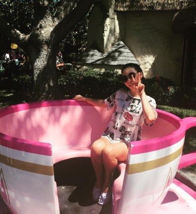 Indiana Massara posing for a photo shoot for her Instagram feed.